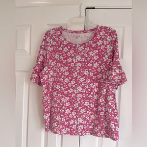 Pretty floral knit top with ruffle sleeve.